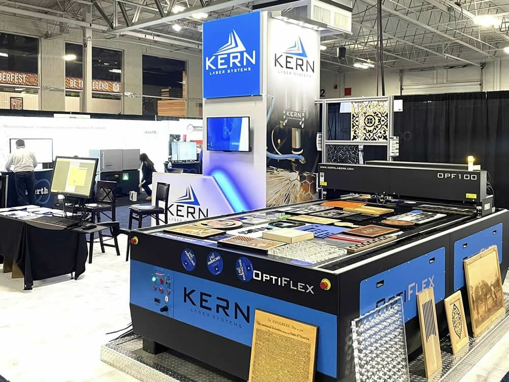 Kern Laser Systems trade show booth displaying wide format precision laser cutting equipment