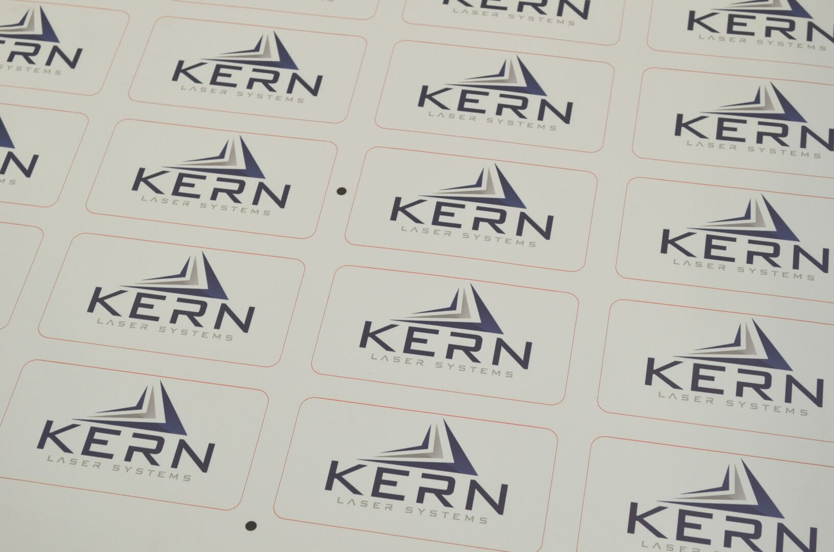 Overlay nameplates and industrial control panels laser cut with optical vision registration